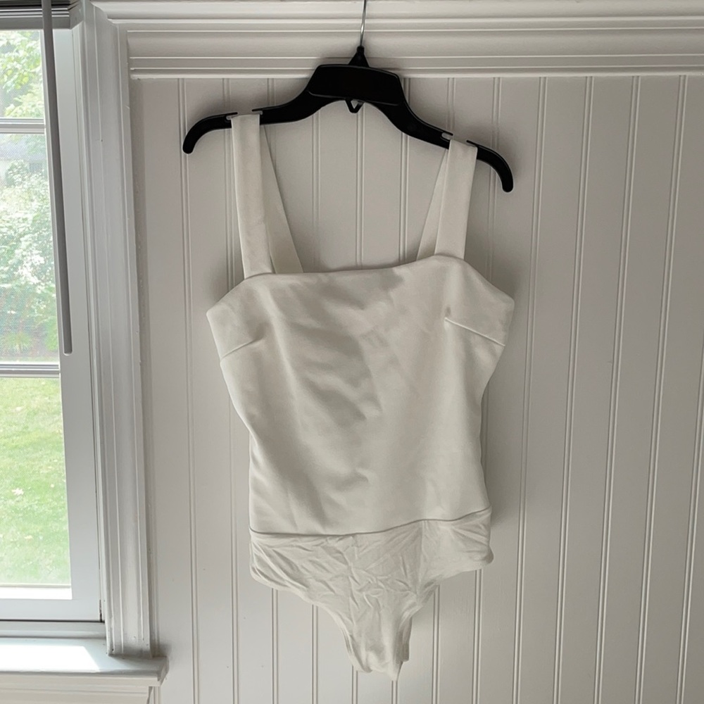 Lulu’s White Bodysuit.